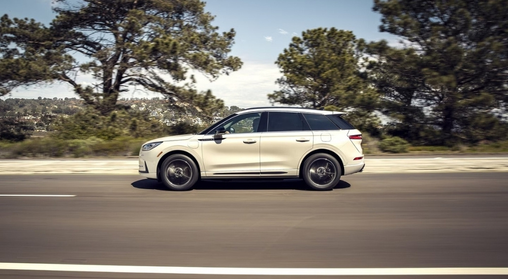 A white 2025 Lincoln Corsair from the side after leaving a Lincoln dealer.