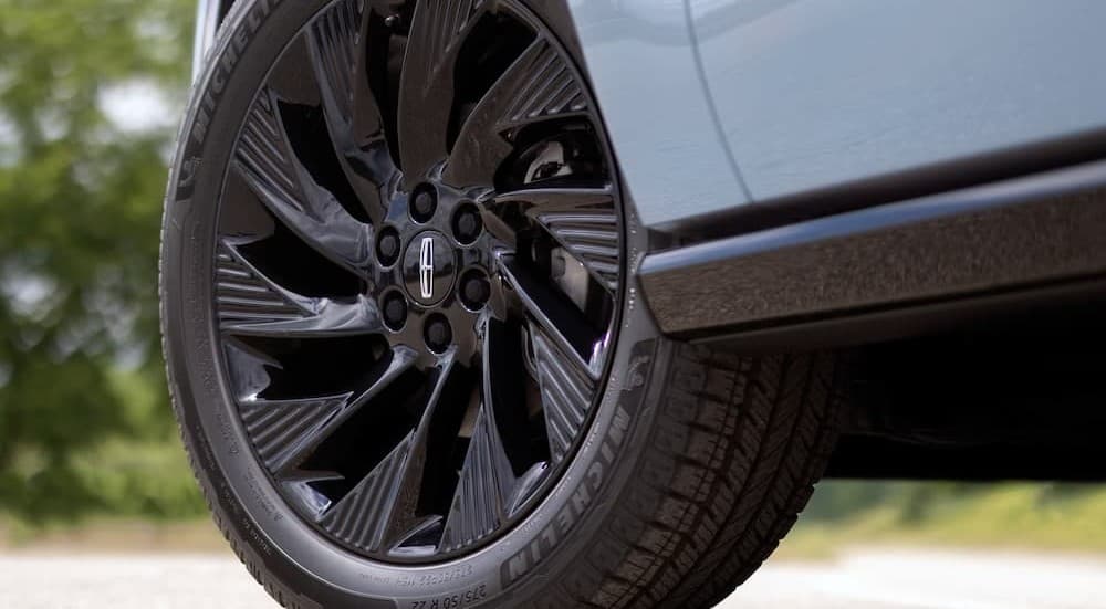 The wheel on a blue 2027 Lincoln Navigator.