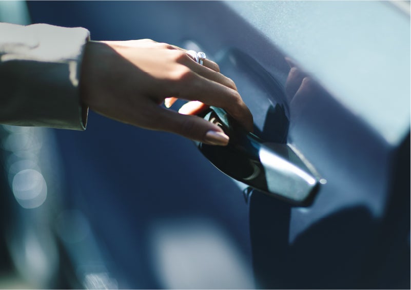 A hand gracefully grips the Light Touch Handle of a 2023 Lincoln Aviator® SUV to demonstrate its ease of use | LaFontaine Lincoln Grand Rapids in Grand Rapids MI