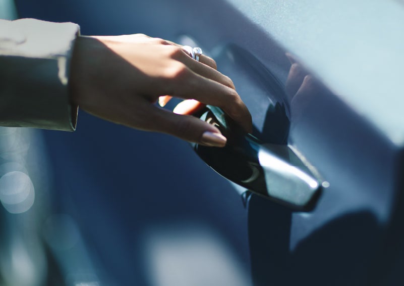 A hand gracefully grips the Light Touch Handle of a 2024 Lincoln Aviator® SUV to demonstrate its ease of use | LaFontaine Lincoln Grand Rapids in Grand Rapids MI