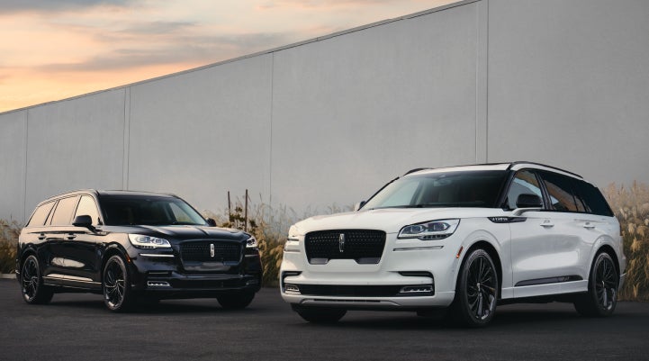Two Lincoln Aviator® SUVs are shown with the available Jet Appearance Package | LaFontaine Lincoln Grand Rapids in Grand Rapids MI