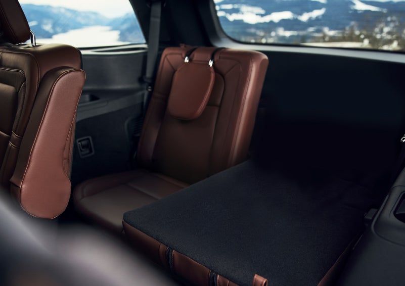 The left rear seat of a 2024 Lincoln Aviator® SUV is shown folded flat for additional cargo space | LaFontaine Lincoln Grand Rapids in Grand Rapids MI