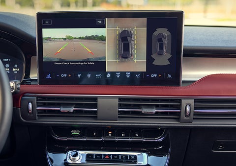 The driver of a 2024 Lincoln Corsair® SUV is shown selecting the drive mode. | LaFontaine Lincoln Grand Rapids in Grand Rapids MI