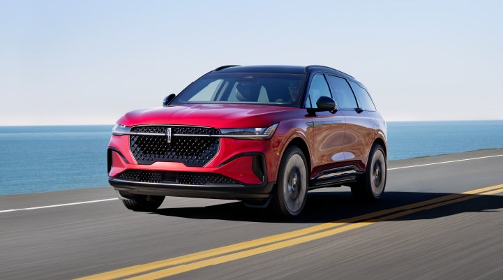 A 2024 Lincoln Nautilus® SUV is being driven on a seaside roadway. | LaFontaine Lincoln Grand Rapids in Grand Rapids MI