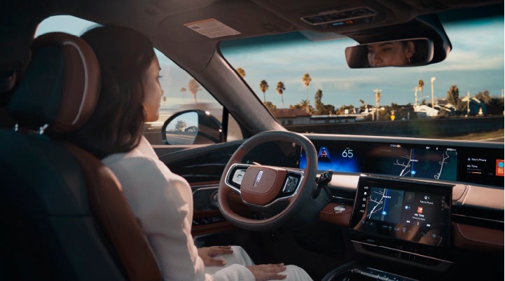 A person is shown driving hands-free on the highway with available Lincoln BlueCruise technology. | LaFontaine Lincoln Grand Rapids in Grand Rapids MI