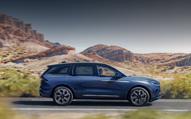 A 2024 Lincoln Nautilus® SUV is being driven in a desert setting. | LaFontaine Lincoln Grand Rapids in Grand Rapids MI