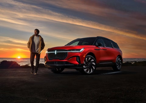 A person is shown next to a 2024 Lincoln Nautilus® SUV as the Lincoln Embrace sequence takes place. | LaFontaine Lincoln Grand Rapids in Grand Rapids MI