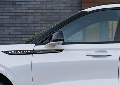 The driver’s door of a white 2025 Lincoln Aviator® SUV is showcased. | LaFontaine Lincoln Grand Rapids in Grand Rapids MI