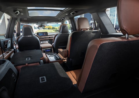 The interior of the 2025 Lincoln Aviator® SUV is shown with two seats folded down for added space. | LaFontaine Lincoln Grand Rapids in Grand Rapids MI
