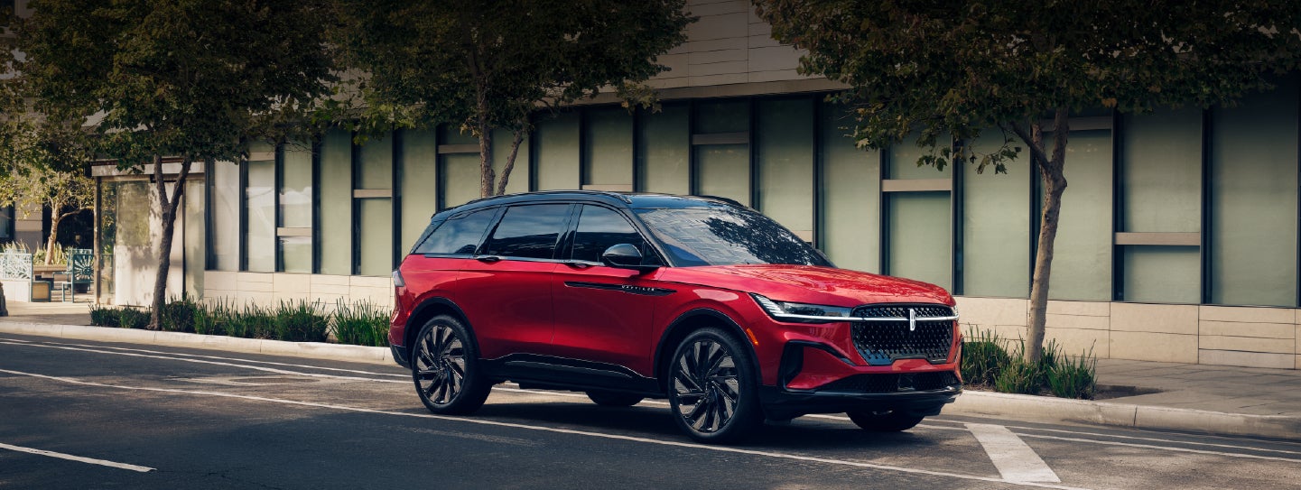 A 2025 Lincoln Nautilus® SUV with an available hybrid powertrain is parked in an urban setting. | LaFontaine Lincoln Grand Rapids in Grand Rapids MI