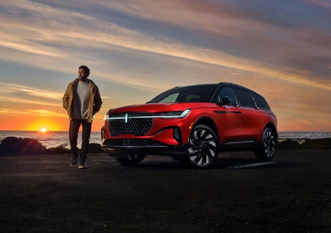 A person is shown next to a 2025 Lincoln Nautilus® SUV as the Lincoln Embrace sequence takes place. | LaFontaine Lincoln Grand Rapids in Grand Rapids MI