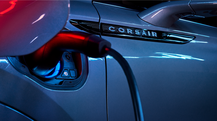 A charger plugged into the charging port of a 2025 Lincoln Corsair® Plug-in Hybrid model. | LaFontaine Lincoln Grand Rapids in Grand Rapids MI