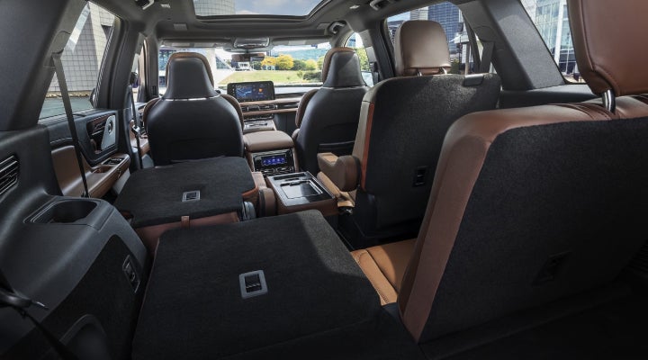 One side of the PowerFold® third-row seat and a second-row seat are folded forward in the 2026 Lincoln Aviator® SUV. | LaFontaine Lincoln Grand Rapids in Grand Rapids MI