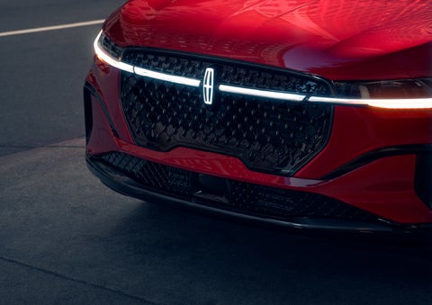 The available front LED light bar and center Lincoln Star logo glow at dusk. | LaFontaine Lincoln Grand Rapids in Grand Rapids MI