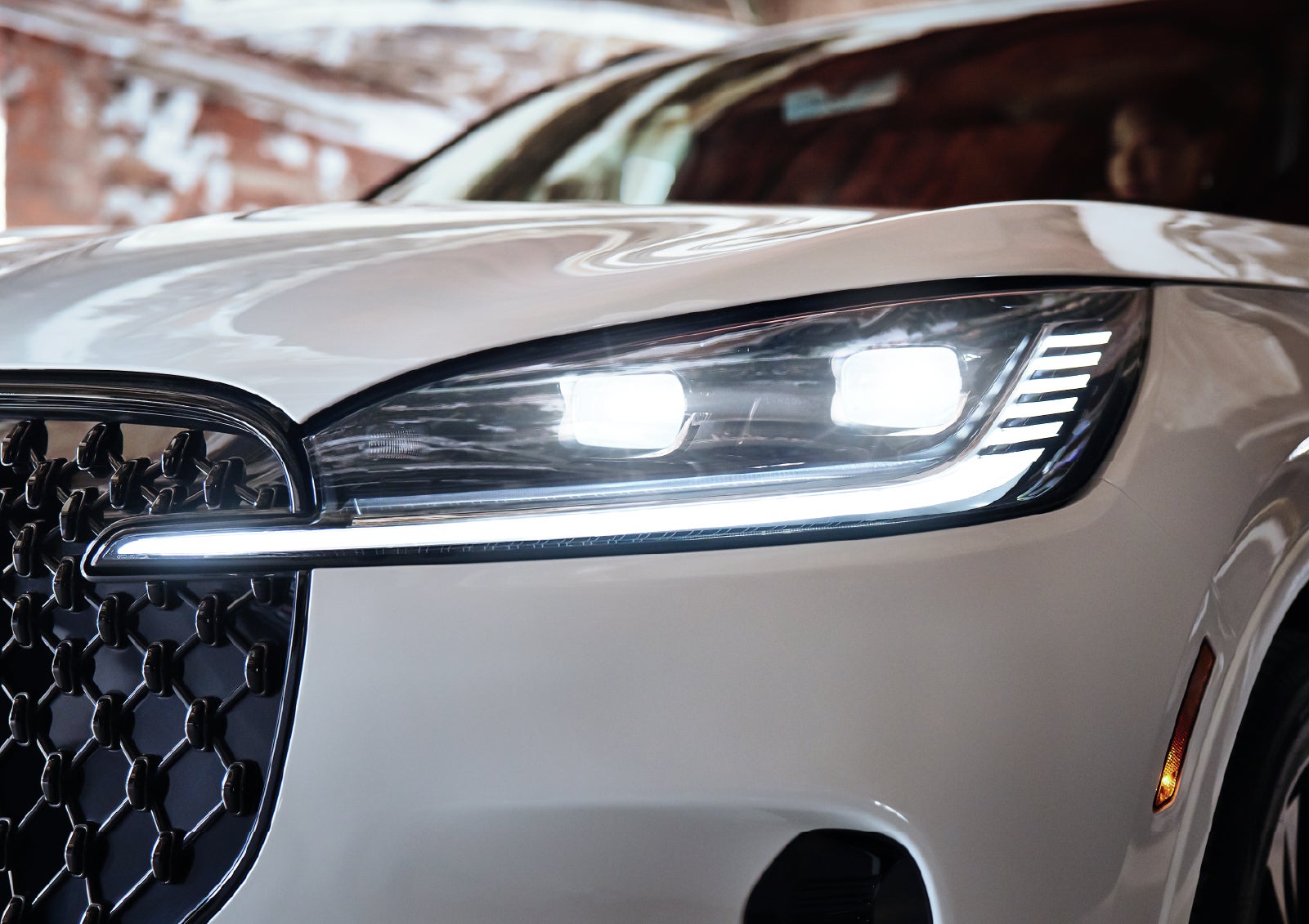 A close-up of a headlamp on the 2027 Lincoln Aviator® SUV is shown. | LaFontaine Lincoln Grand Rapids in Grand Rapids MI