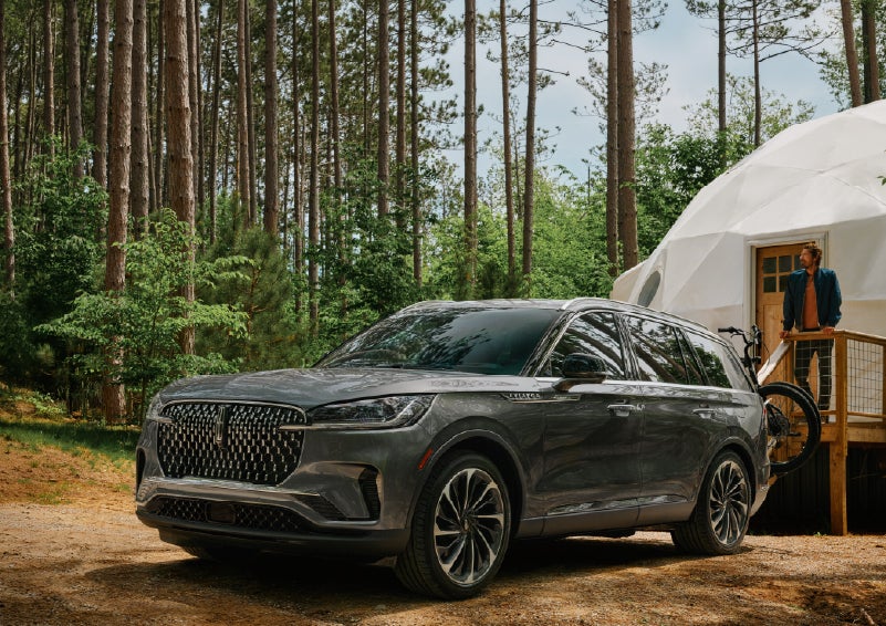 A 2027 Lincoln Aviator® is parked next to a high end glamping site. | LaFontaine Lincoln Grand Rapids in Grand Rapids MI