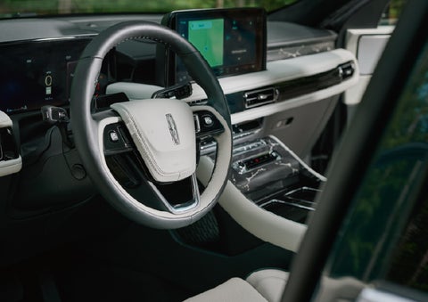 The leather-trimmed steering wheel of a 2027 Lincoln Aviator® Black Label™ SUV. | LaFontaine Lincoln Grand Rapids in Grand Rapids MI