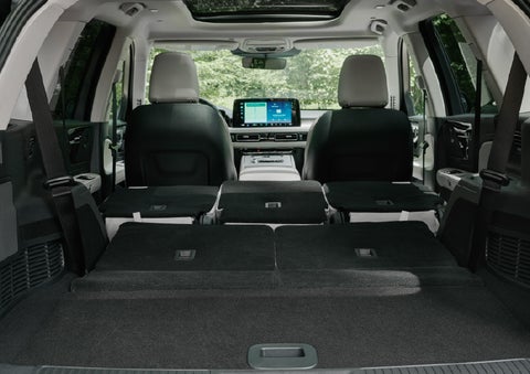 A rear to front view of the interior of a 2027 Lincoln Aviator® Black Label™ SUV shows the third and second rows folded flat | LaFontaine Lincoln Grand Rapids in Grand Rapids MI