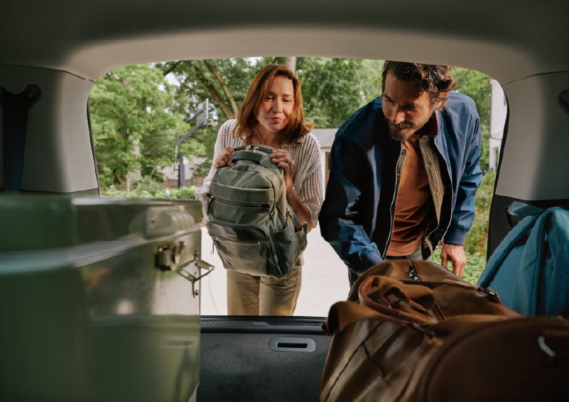 A couple loads luggage into the rear of a 2027 Lincoln Aviator® Black Label™ SUV..e 202 | LaFontaine Lincoln Grand Rapids in Grand Rapids MI