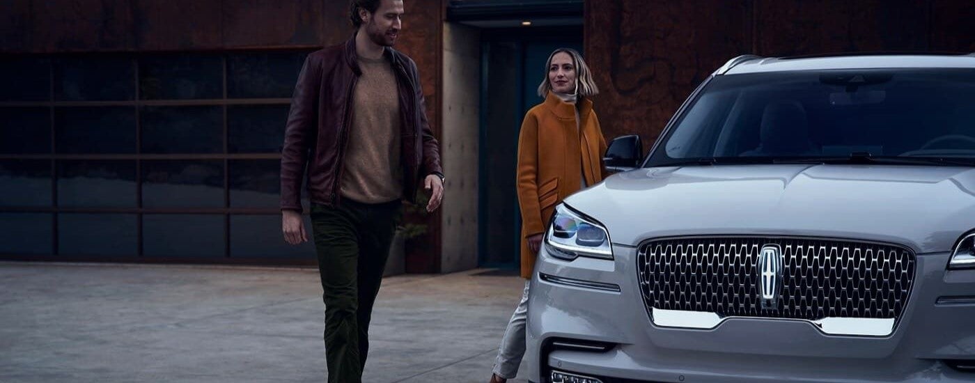 A white 2023 Lincoln Aviator parked in a driveway.