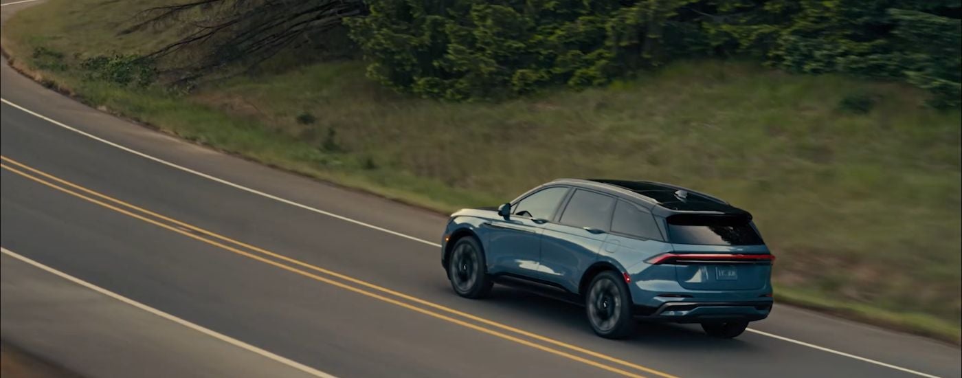 Blue 2026 Lincoln Nautilus shown from above driving on a road.