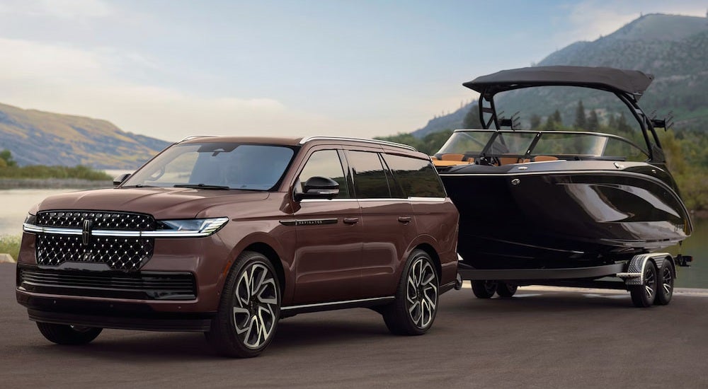 Brown 2026 Lincoln Navigator towing a boat.
