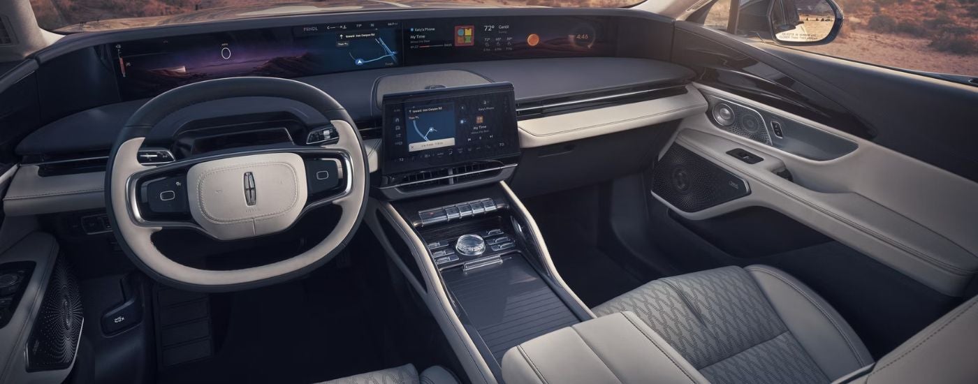 2026 Lincoln Nautilus front interior showing steering wheel and infotainment.