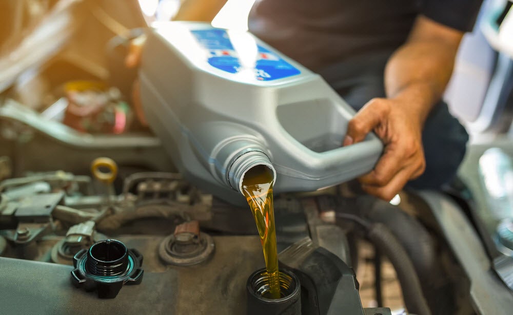 Service Technician Changing the Oil of a New Lincoln